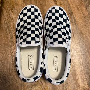 Black and white checkered slip on tennis shoes